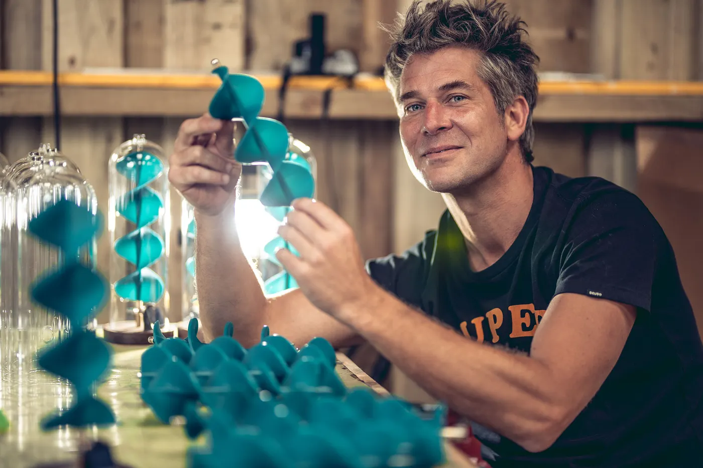 Tom Lawton making kinetic sculptures in his workshop